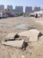 玉泉区这条长300米的坑洼石头土路何时能改造?